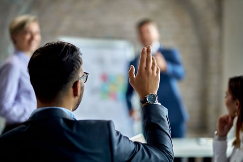 business-man-raising-hand-edited-750w business-man-raising-hand-edited-750w